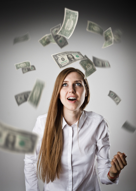 Rejoicing. Woman in white and dollars. - Foto, Imagen