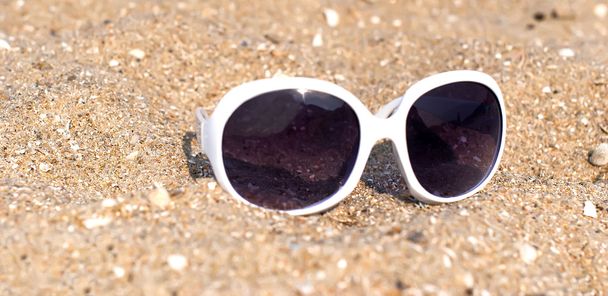 Sunglasses on the sand - Photo, Image