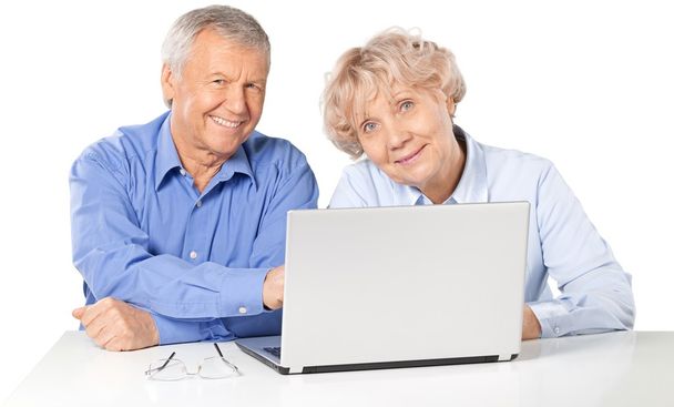 happy senior couple with laptop - Foto, afbeelding