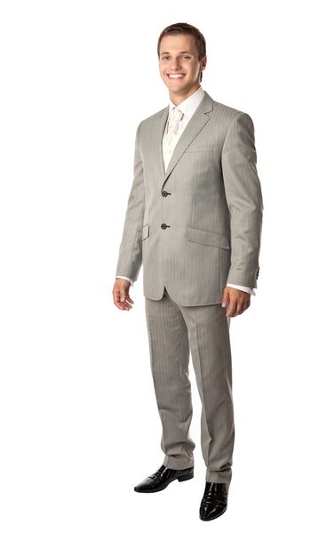 Full length of a young man in a suit smiling brightly - Foto, immagini