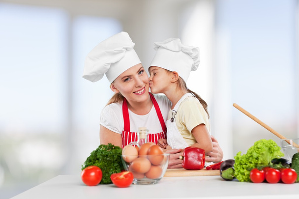girl and her mother cooking together  - Φωτογραφία, εικόνα