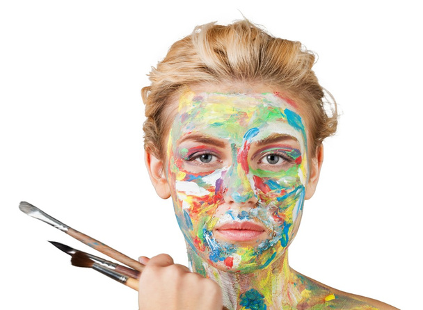  woman with painted  face and paintbrushes  - Foto, imagen
