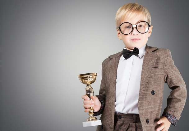 boy in  glasses holding trophy - Foto, immagini