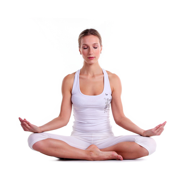 Mujer joven practicando yoga, sentada en posición de loto
 - Foto, Imagen
