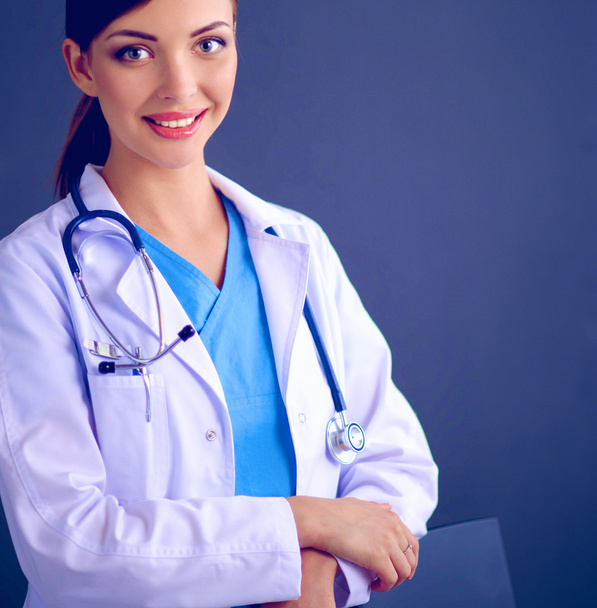 Doctor woman with stethoscope isolated on grey background - Foto, afbeelding