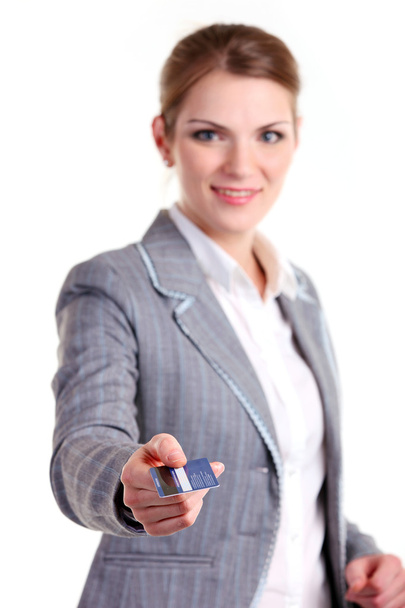 Young business woman stretching out hand with plastic card - Zdjęcie, obraz