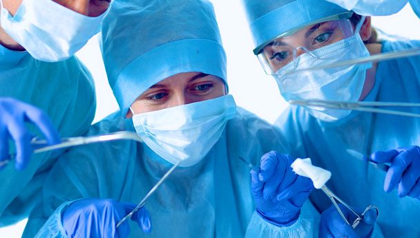 Below view of surgeons holding medical instruments in hands - Foto, Imagem