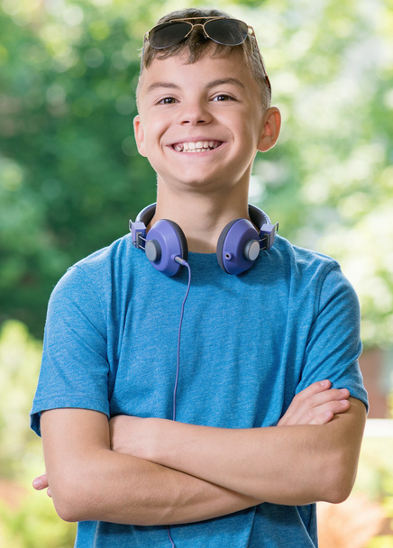 Teen boy with headphones - 写真・画像