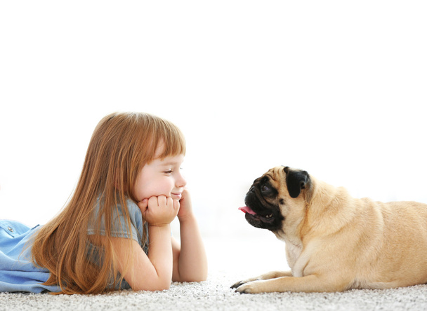 Cute girl playing with dog  - 写真・画像