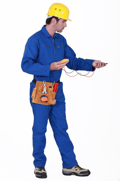 Electrician with an multi-meter - Foto, Imagem