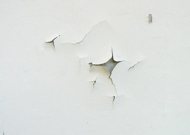 Cracked and aged white wall facade texture or background. - 写真・画像