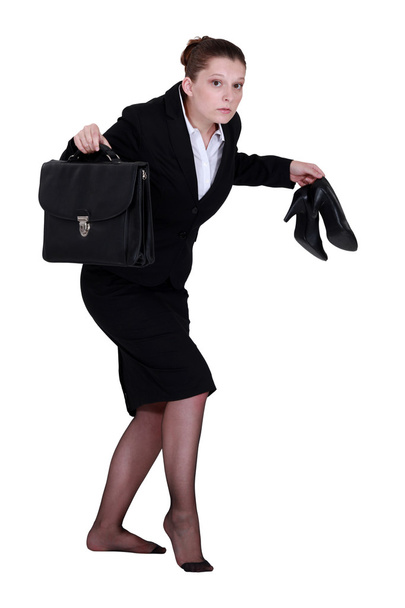 A businesswoman leaving quietly. - Фото, изображение