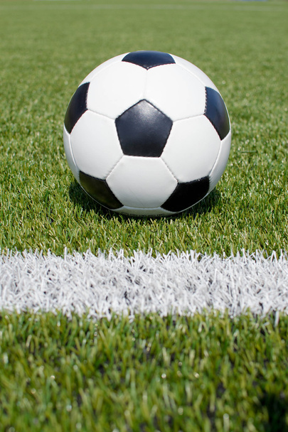soccer ball on the green field - Фото, изображение