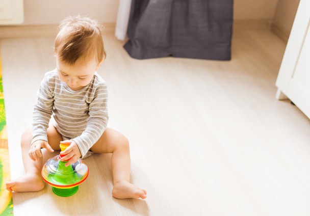 baby boy playing with toy indoors at home - Фото, зображення