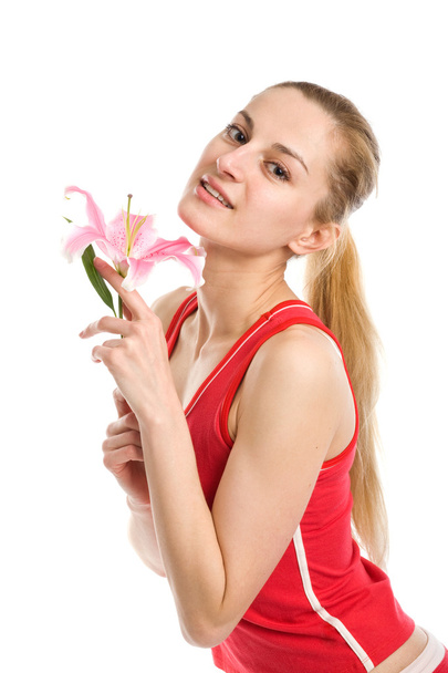 Linda chica con un lirio rosa
 - Foto, Imagen