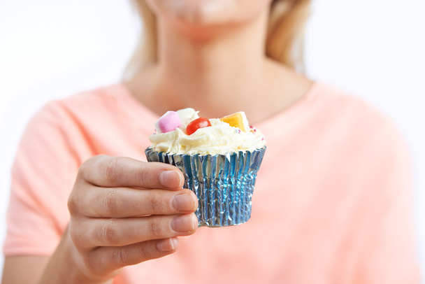 Close Up Of Woman Holding Unhealthy Cupcake - Fotoğraf, Görsel