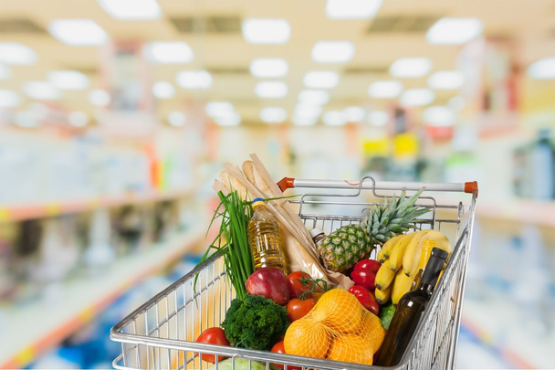 shopping cart full with various groceries - Valokuva, kuva
