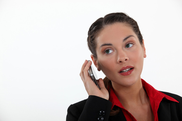 Woman with cell phone straining her ears - Photo, Image