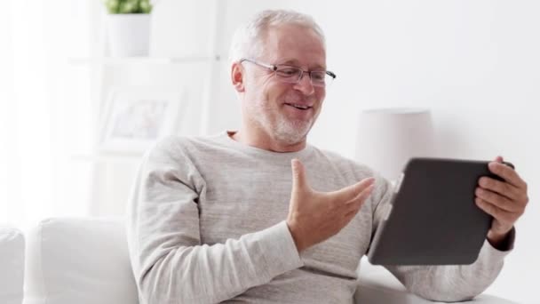senior man having video call on tablet pc at home 89 - Imágenes, Vídeo