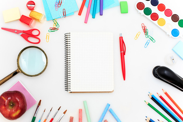 School set with notebooks, pencils, brush, scissors and apple on white background - Foto, Imagen