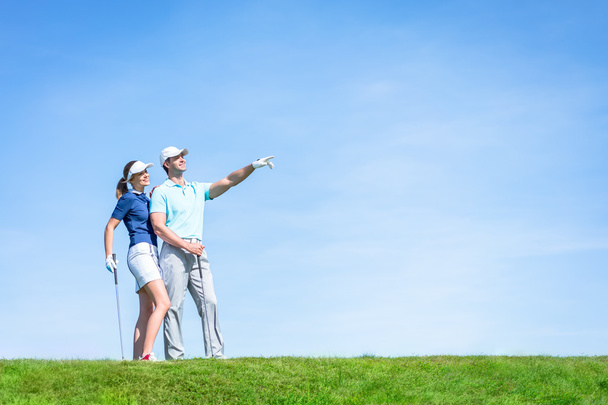 Young couple playing golf - Photo, Image