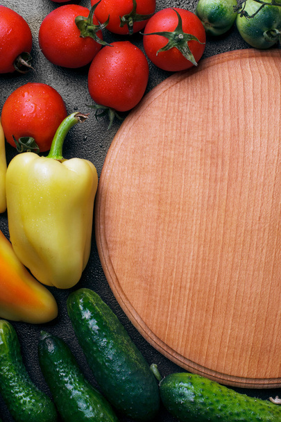 vegetables(Sweet pepper, cucumber,  tomatoes) on the stone black - Zdjęcie, obraz