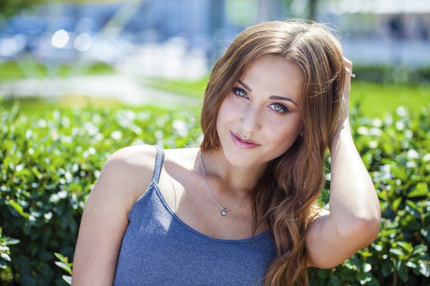 Portrait close up of young beautiful brunette woman - Photo, Image