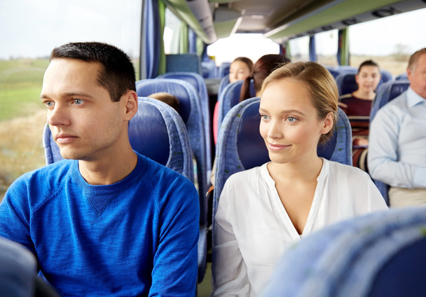 happy couple or passengers in travel bus - Fotó, kép