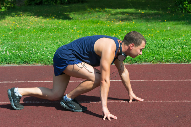 Young athlete on the training track - Photo, Image