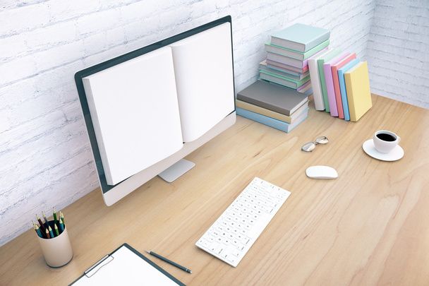 Creative wooden office desktop with book screened computer, keyboard, coffee cup, glasses and stationery items on white brick wall background. - Photo, Image
