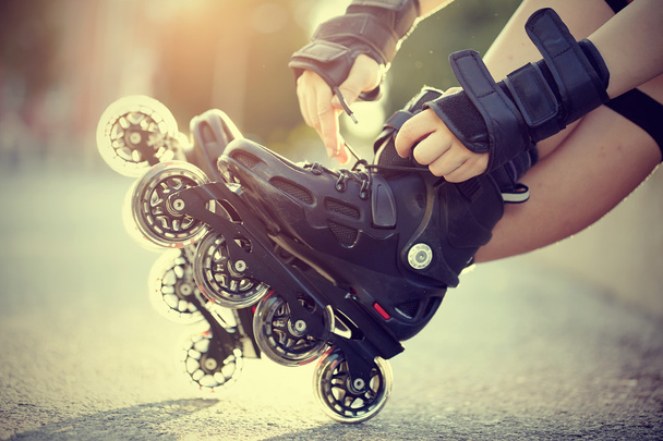 Setting of laces on roller skates - Photo, Image