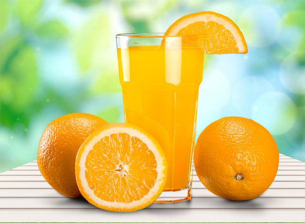 Orange juice and slices of orange - Photo, image