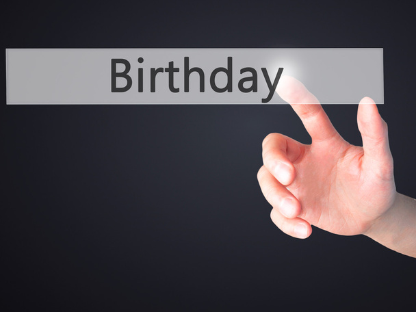 Birthday - Hand pressing a button on blurred background concept  - Photo, Image