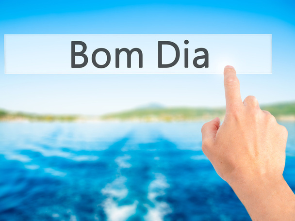 Bom Dia (ポルトガル語 - おはようございます) - ボタンを押す手  - 写真・画像