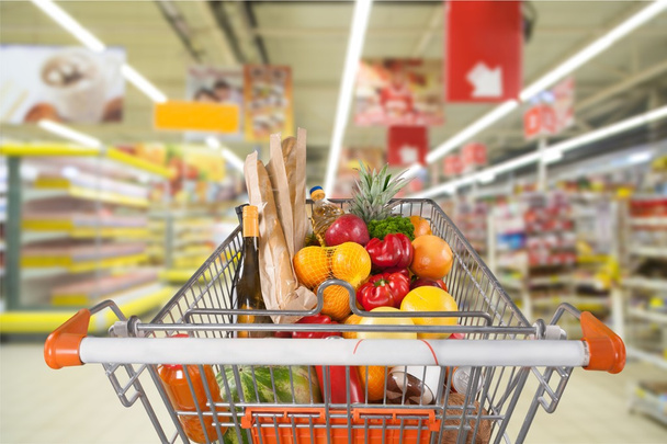 shopping cart full with various groceries - Photo, image