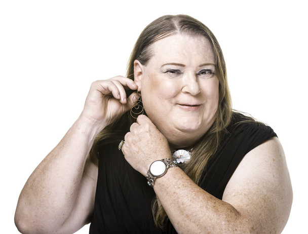 transgender woman adjusting earring - Foto, Imagem
