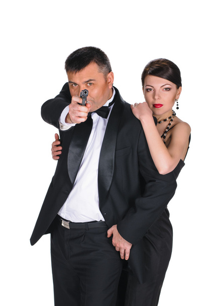 Young couple with gun - Foto, Imagen