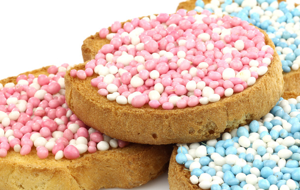 Fette biscottate con granelli di anice bianchi e blu e bianchi e rosa
 - Foto, immagini