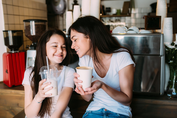 Mother and daughter drink espresso - Photo, Image