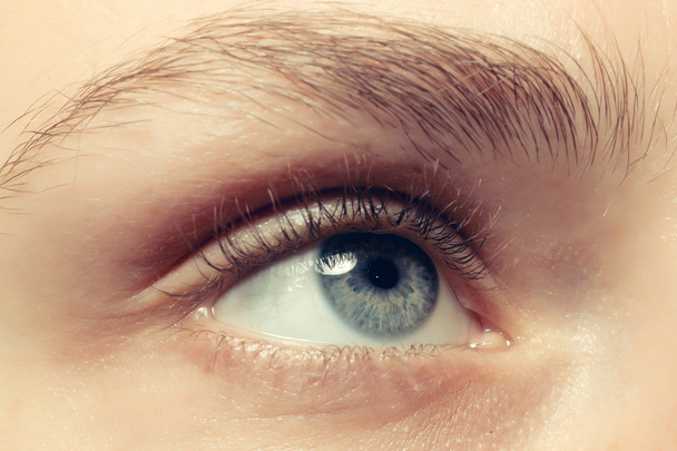 close-up van een blauw oog - Foto, afbeelding