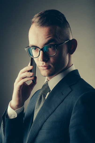 Guy in glasses with mobile phone - Φωτογραφία, εικόνα