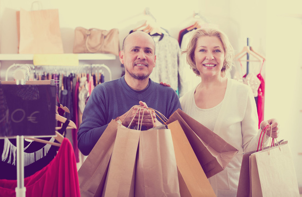 Mature spouses carrying bags with purchases - Photo, Image