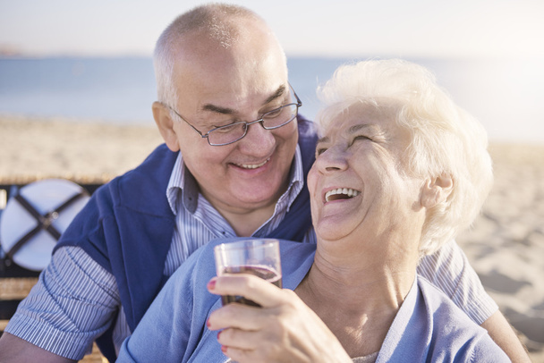 Senior couple enjoying day on the beach   - Photo, Image