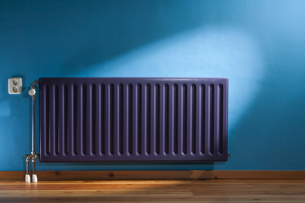 Purple radiator and a blue wall - Photo, Image