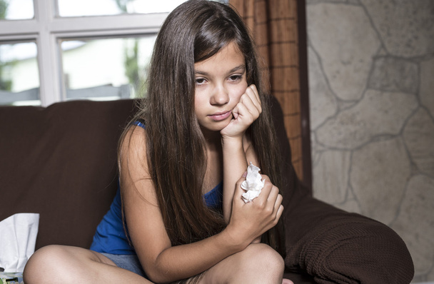 girl sad tears with tissue - Фото, изображение