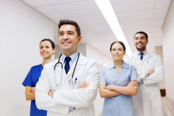 group of happy medics or doctors at hospital - Фото, изображение