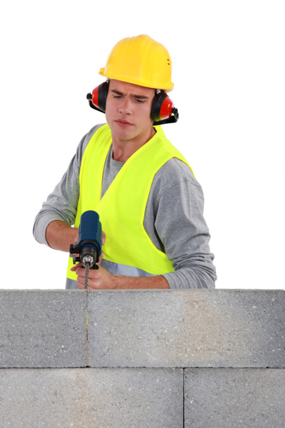 Builder using a masonry drill - Photo, Image
