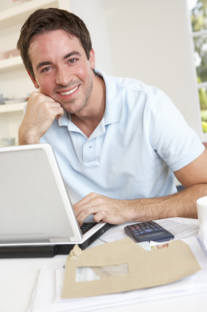 Young man working with laptop computer - Photo, Image
