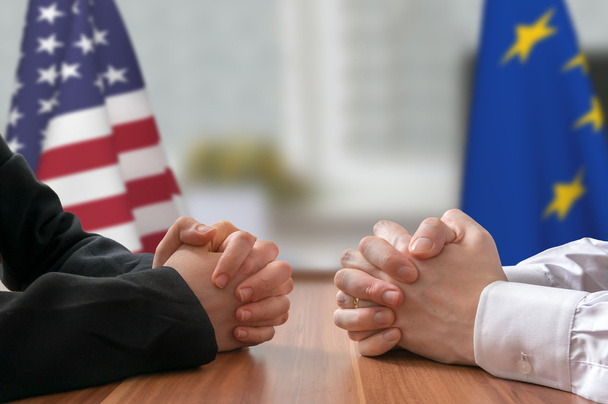 Negotiation of USA and European Union. Statesman or politicians with clasped hands. - 写真・画像