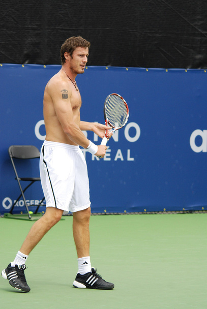 MONTREAL - AUGUST 5: Marat Safin without shirt on court of Montreal Rogers Cup on August 5, 2009 in Montreal, Canada. Safin won two majors and reached the world number 1 ranking during his career. - Photo, image